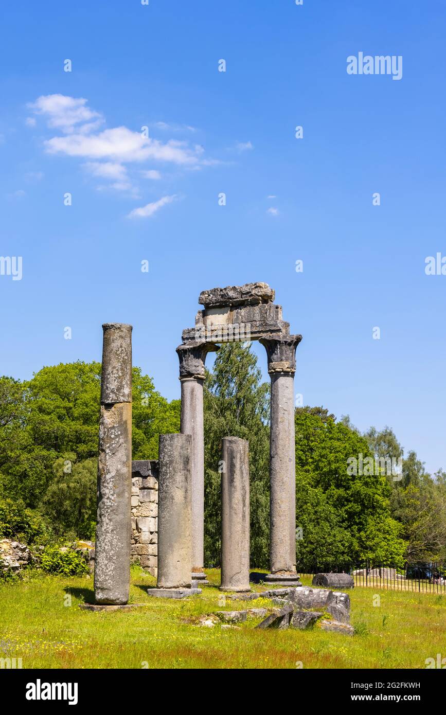 The Ruins, a Georgian arrangement of relocated Leptis Magna Roman columns, stonework and ruins in Virginia Water, Windsor Great Park, Surrey, UK Stock Photo