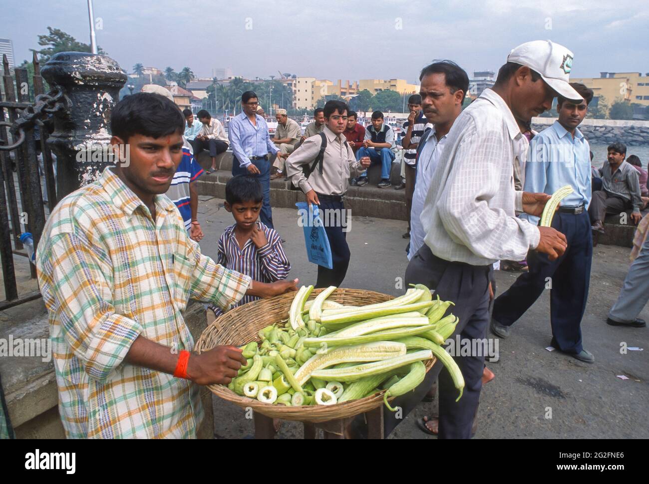 MUMBAI, INDIA Street vendor selling vegetables to customers at ferry terminal Stock Photo Alamy