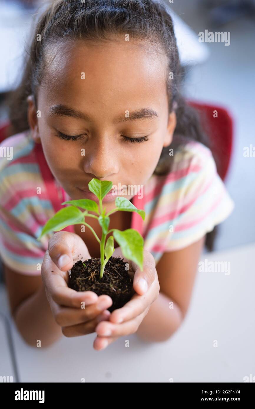 African girl holding a plant hi-res stock photography and images - Alamy
