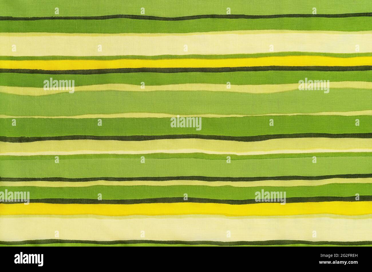 Colorful striped fabric texture. Thin cotton cloth with horizontal colored lines pattern. Textile with green yellow beige brown stripes as background. Stock Photo