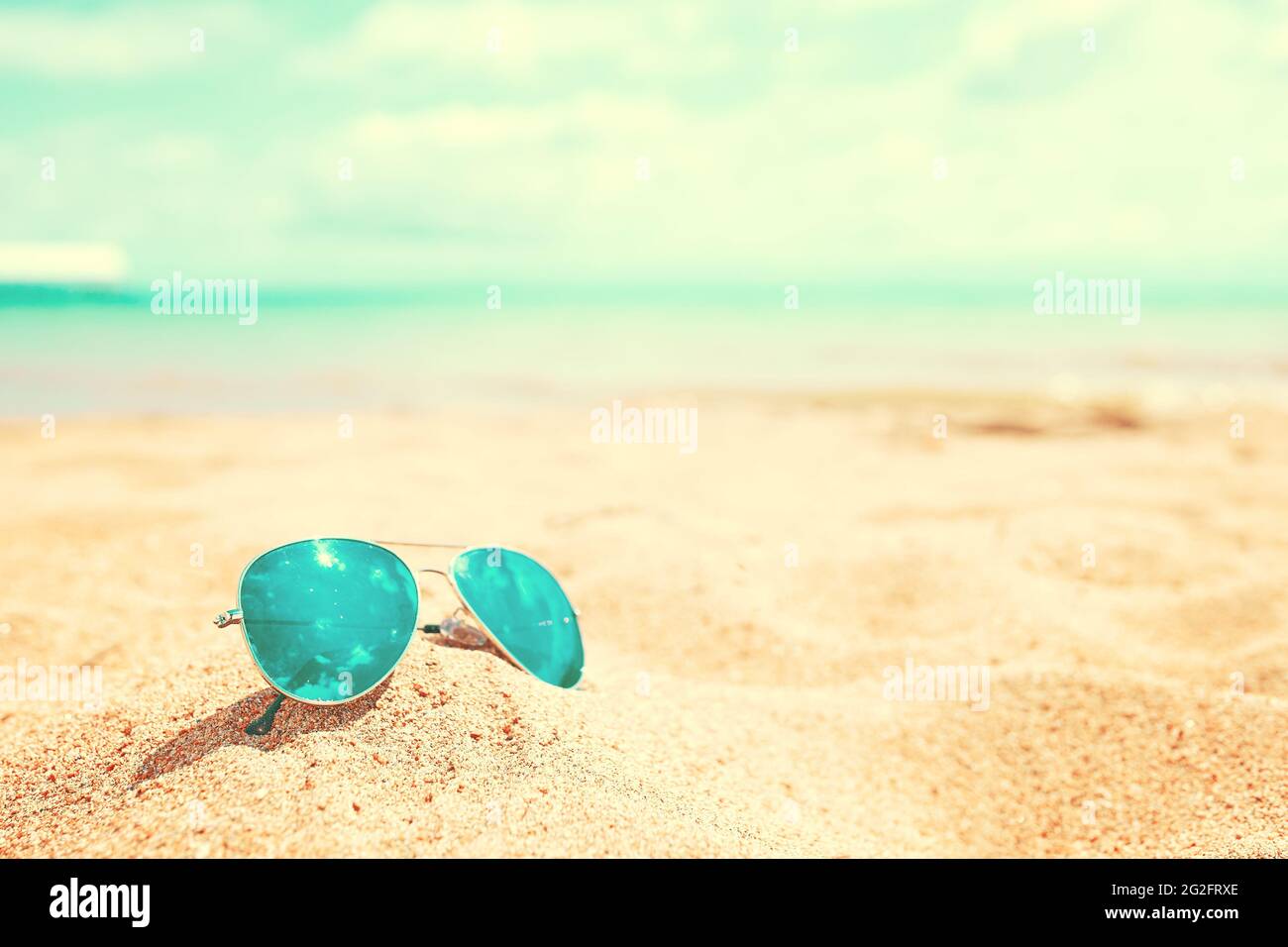 Sunglasses on the beach. Summer holidays at the sea. Vacation on