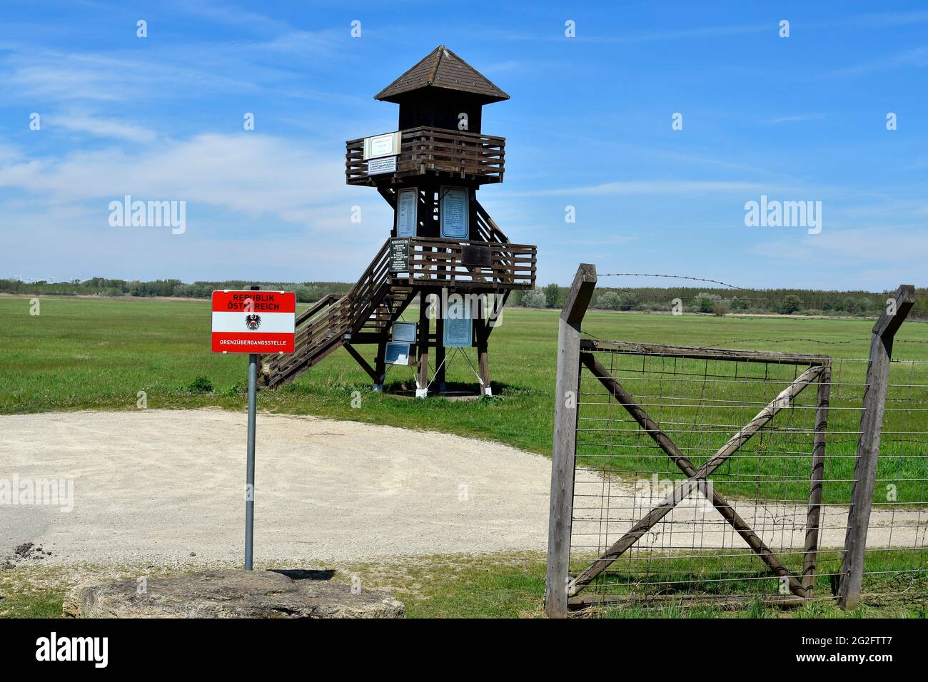 Andau, Austria - May 04, 2021: Lookout tower at the border crossing point with remains of the barbed wire fence  named - Iron Curtain - along the Aust Stock Photo