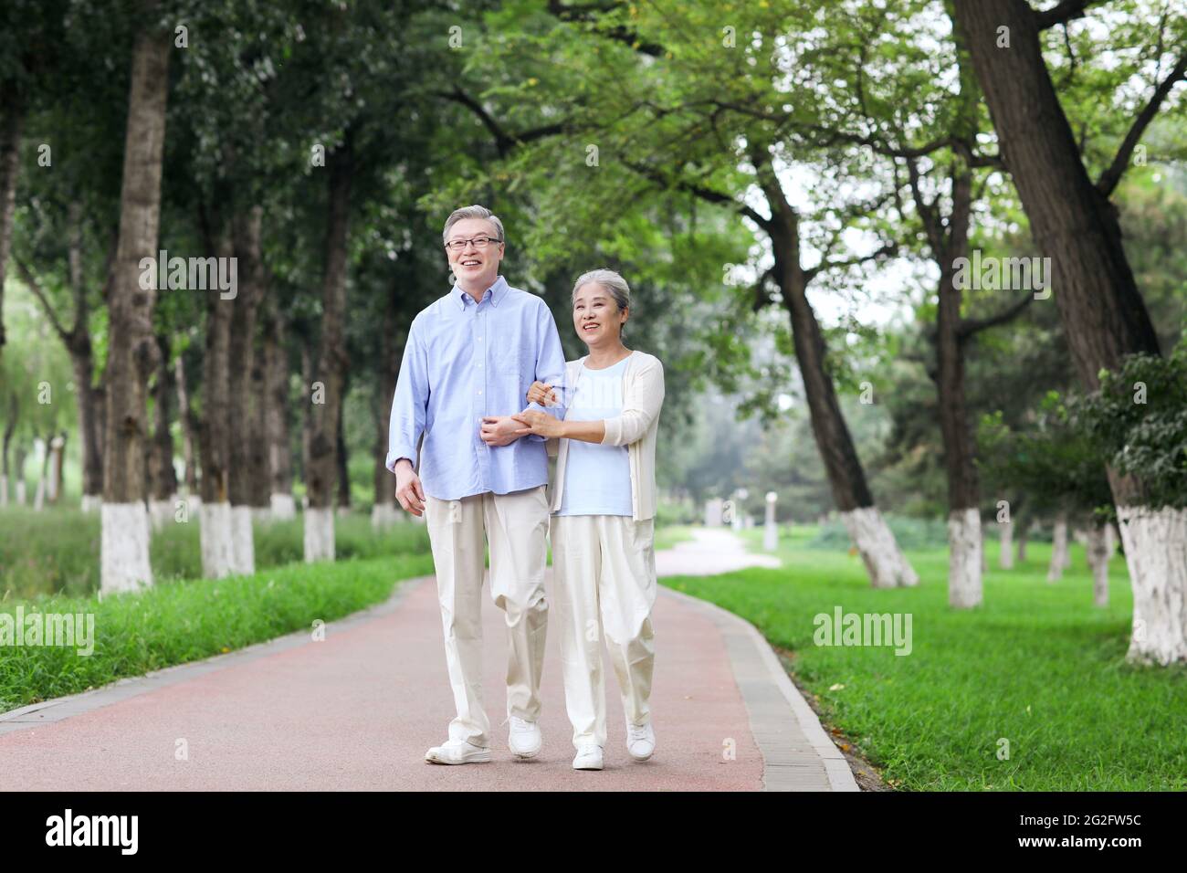 Happy old couple walking in the park high quality photo Stock Photo - Alamy
