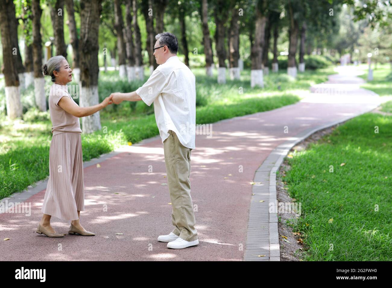 Happy old couple dancing in the park high quality photo Stock Photo - Alamy