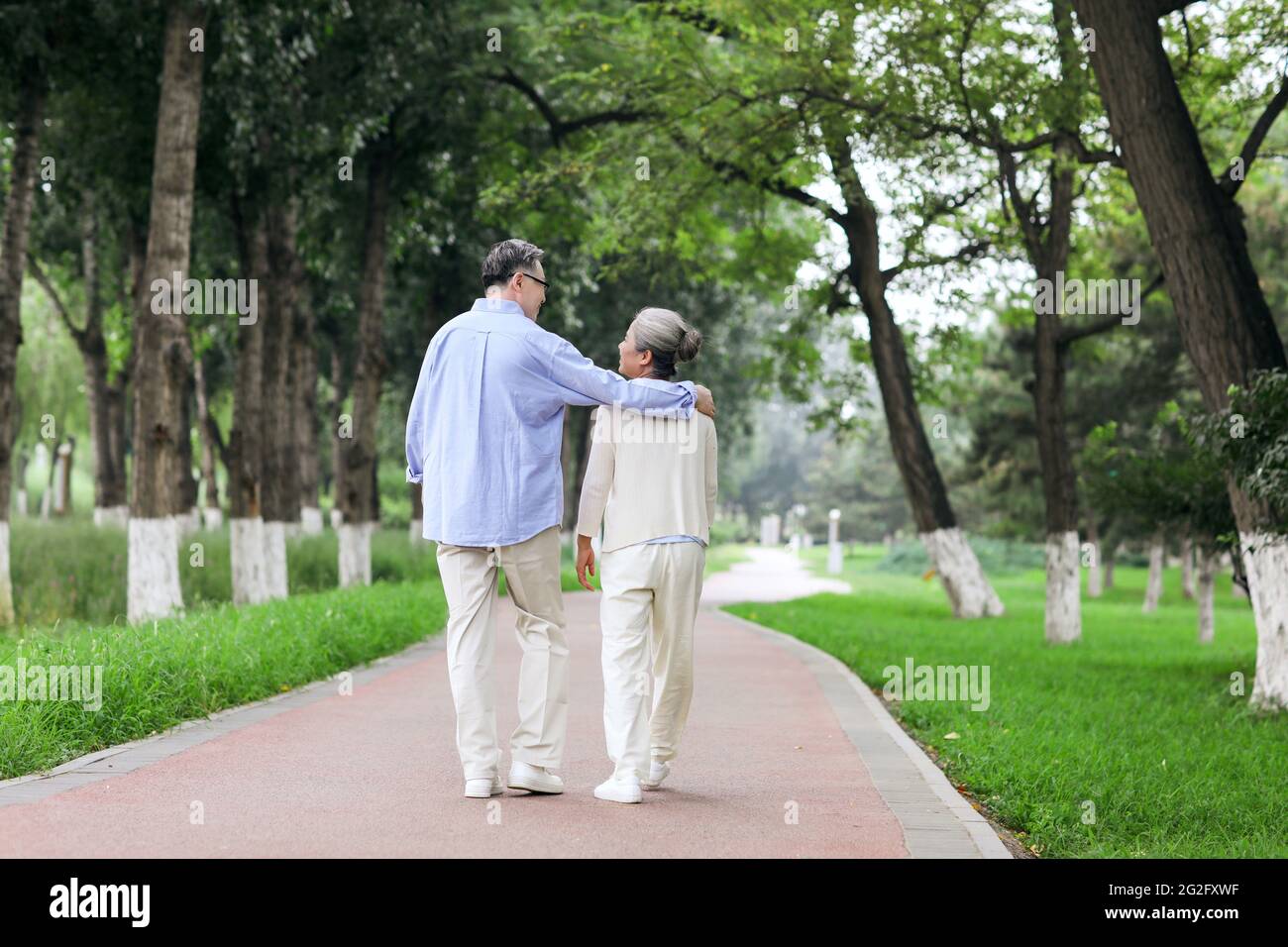 Happy old couple walking in the park high quality photo Stock Photo - Alamy