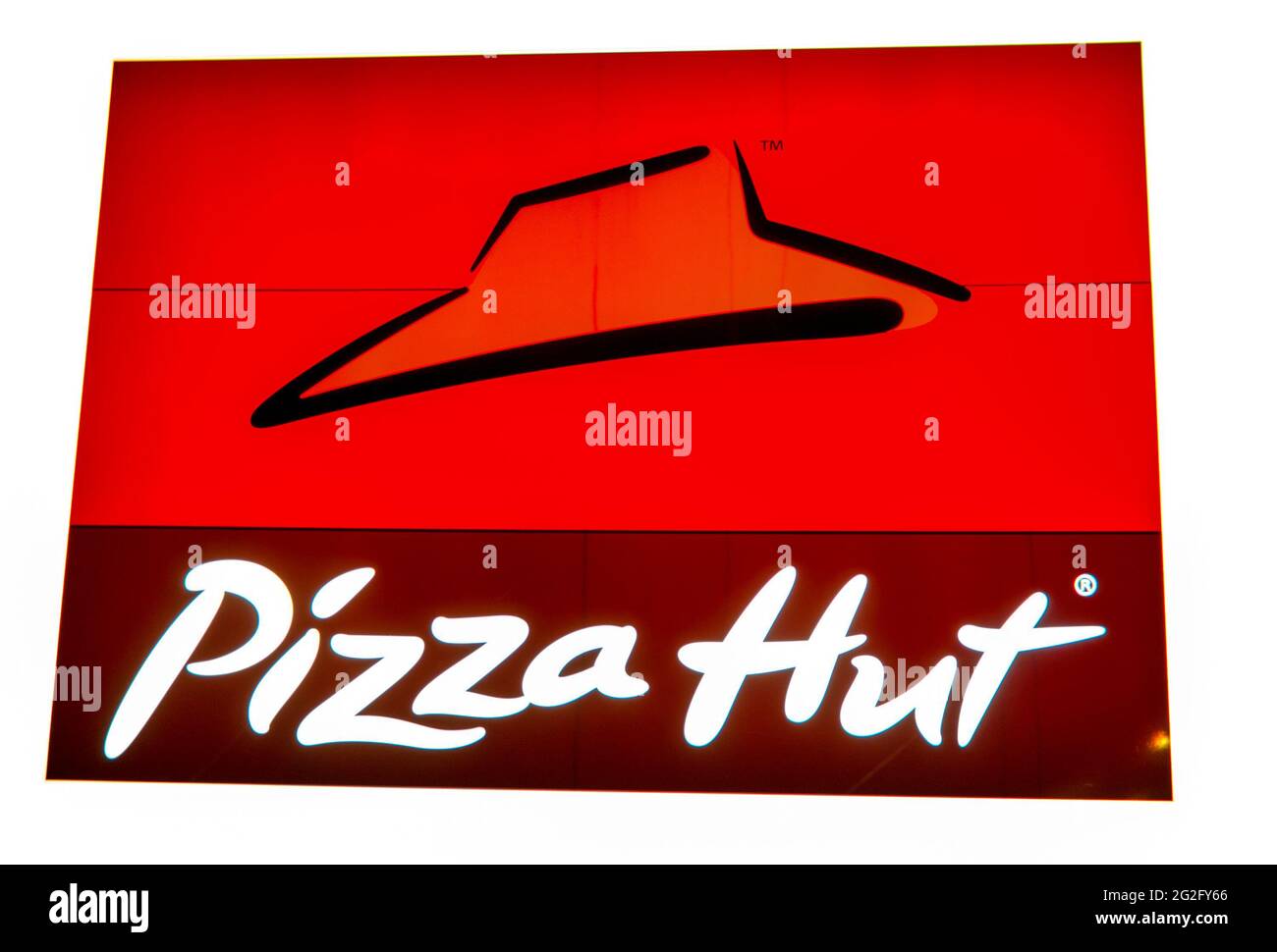 Pizza Hut Restaurant Sign, the brand has taken root in Canadian culture and even in Winter they remain among those offering delivery. Stock Photo