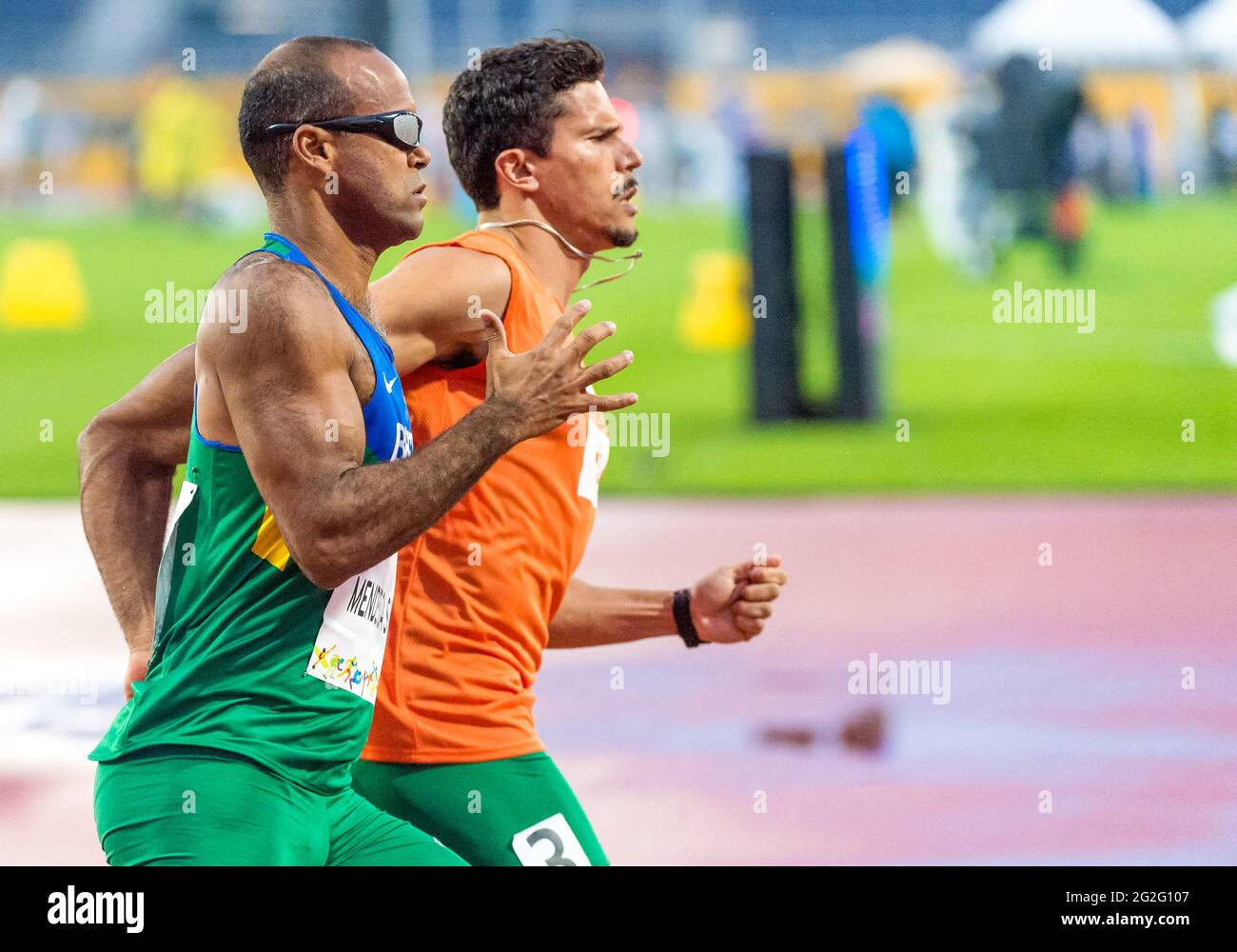 Visually challenged Brazillian athlete running the race with the help of his guide at the 2015 Parapan American Games. The 2015 Parapan American Games Stock Photo