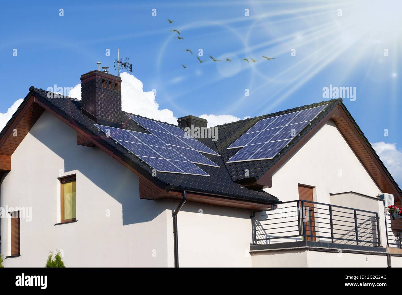Modern House with Solar Panels on the Roof Stock Photo - Alamy
