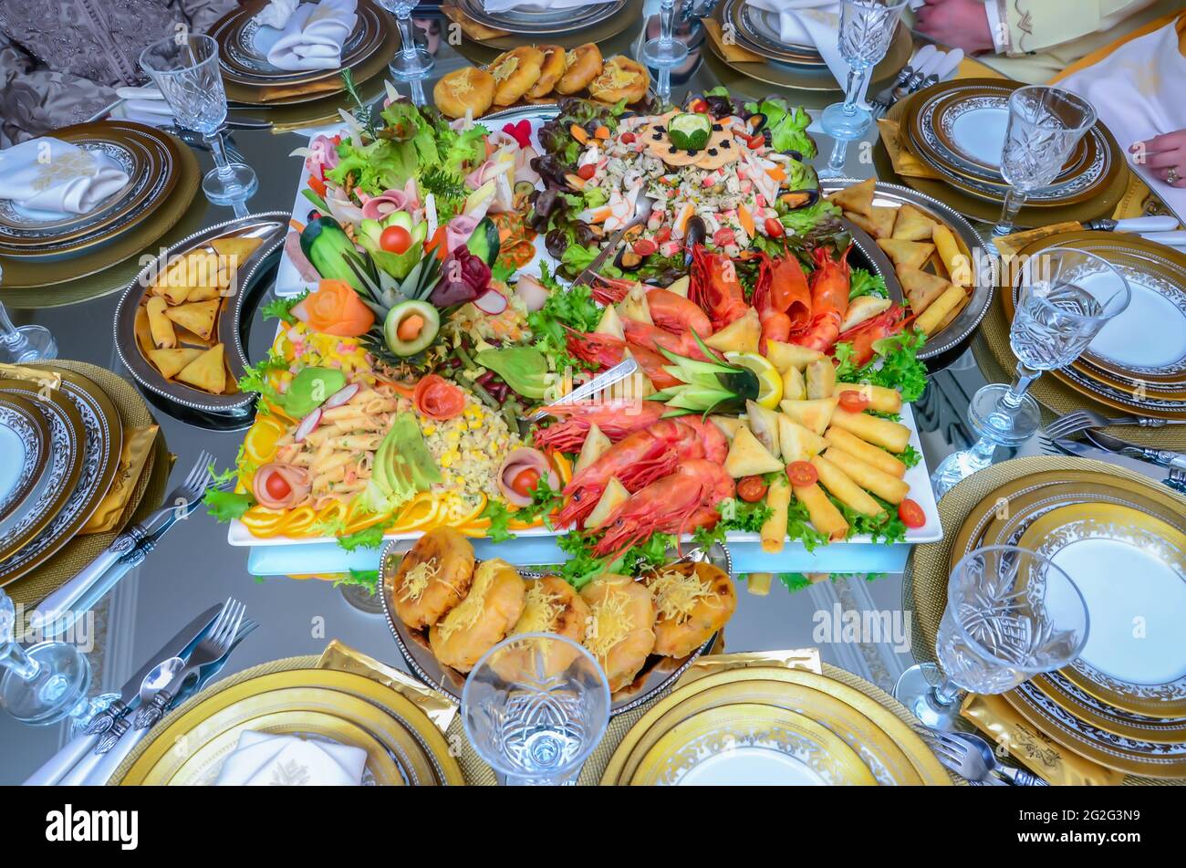 A variety of Moroccan appetizers. Pastilla Shrimp and Salad Stock Photo
