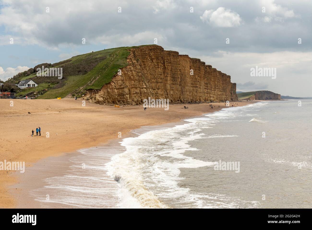 The limestone cliffs and picturesque beach at East Beach, West Bay, Dorset, England, UK Stock Photo