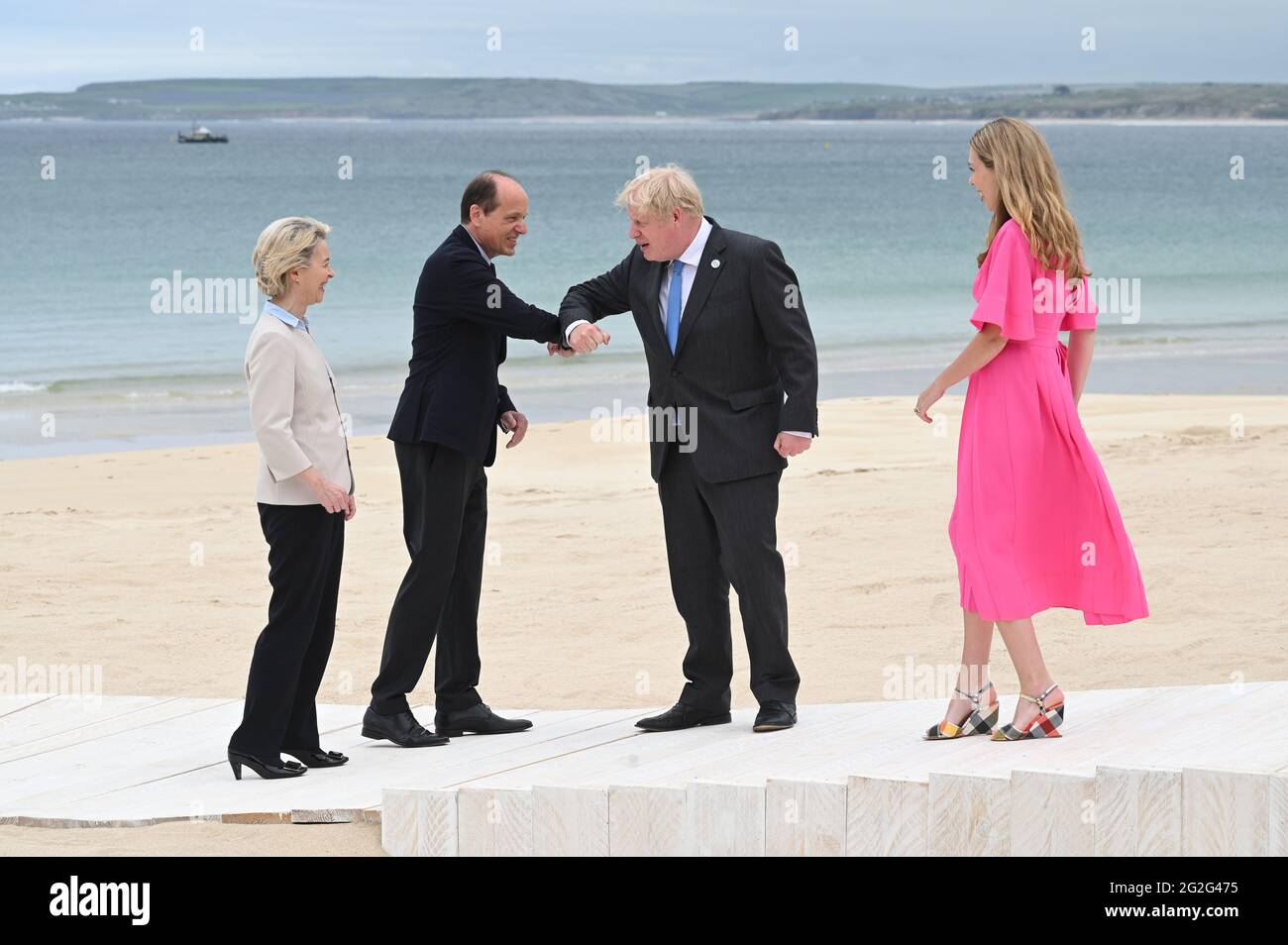 Prime Minister Boris Johnson and Carrie Johnson (right) with European Commission President Ursula von der Leyen and her husband Heiko, during the leaders official welcome and family photo in Carbis Bay, during the G7 summit in Cornwall. Picture date: Friday June 11, 2021. Stock Photo