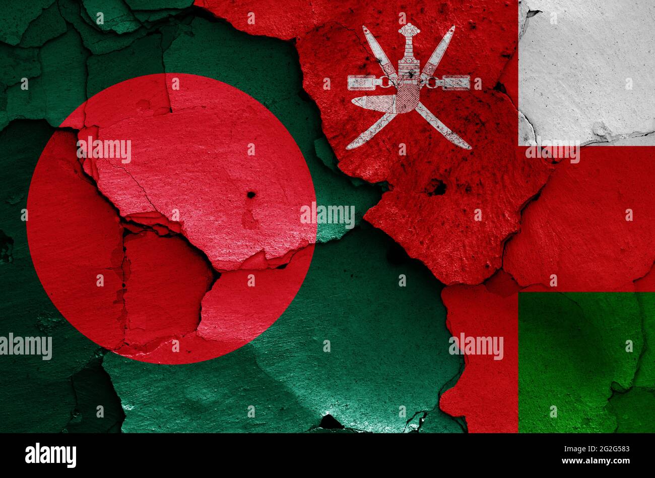 flags of Bangladesh and Oman painted on cracked wall Stock Photo