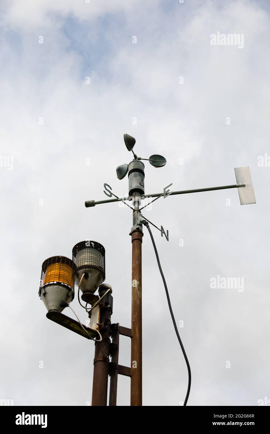 Weather vane and warning lights on the shore at Rutland Water, Rutland, England Stock Photo