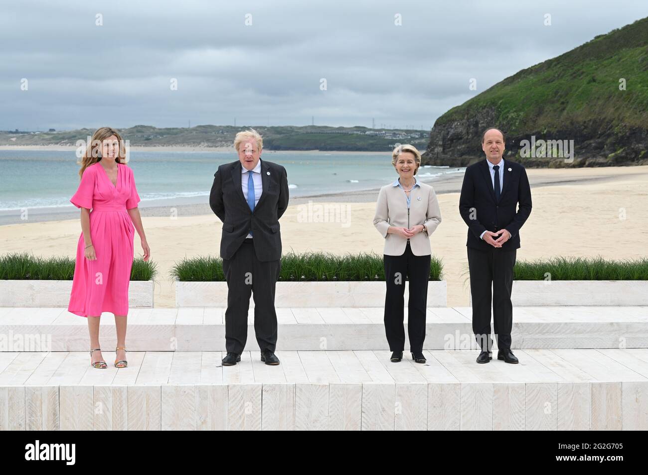 Prime Minister Boris Johnson and Carrie Johnson (left) with President of the European Commission Ursula von der Leyen and her husband Heiko von der Leyen, during the leaders official welcome and family photo, during the G7 summit in Cornwall. Picture date: Friday June 11, 2021. Stock Photo
