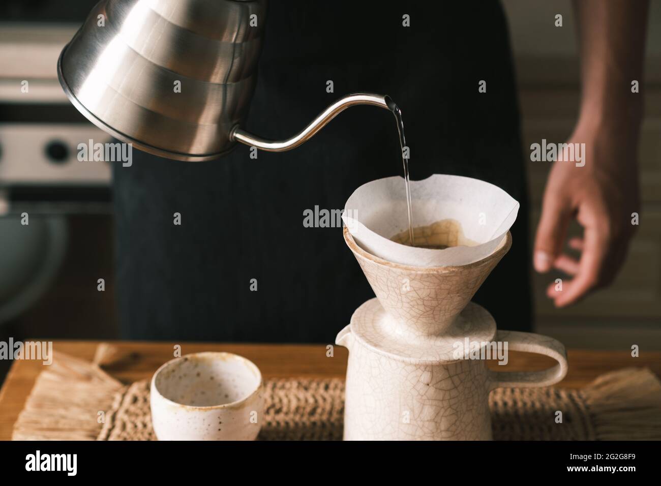 Brewing pourover coffee in the kitchen, alternative coffee makin Stock Photo