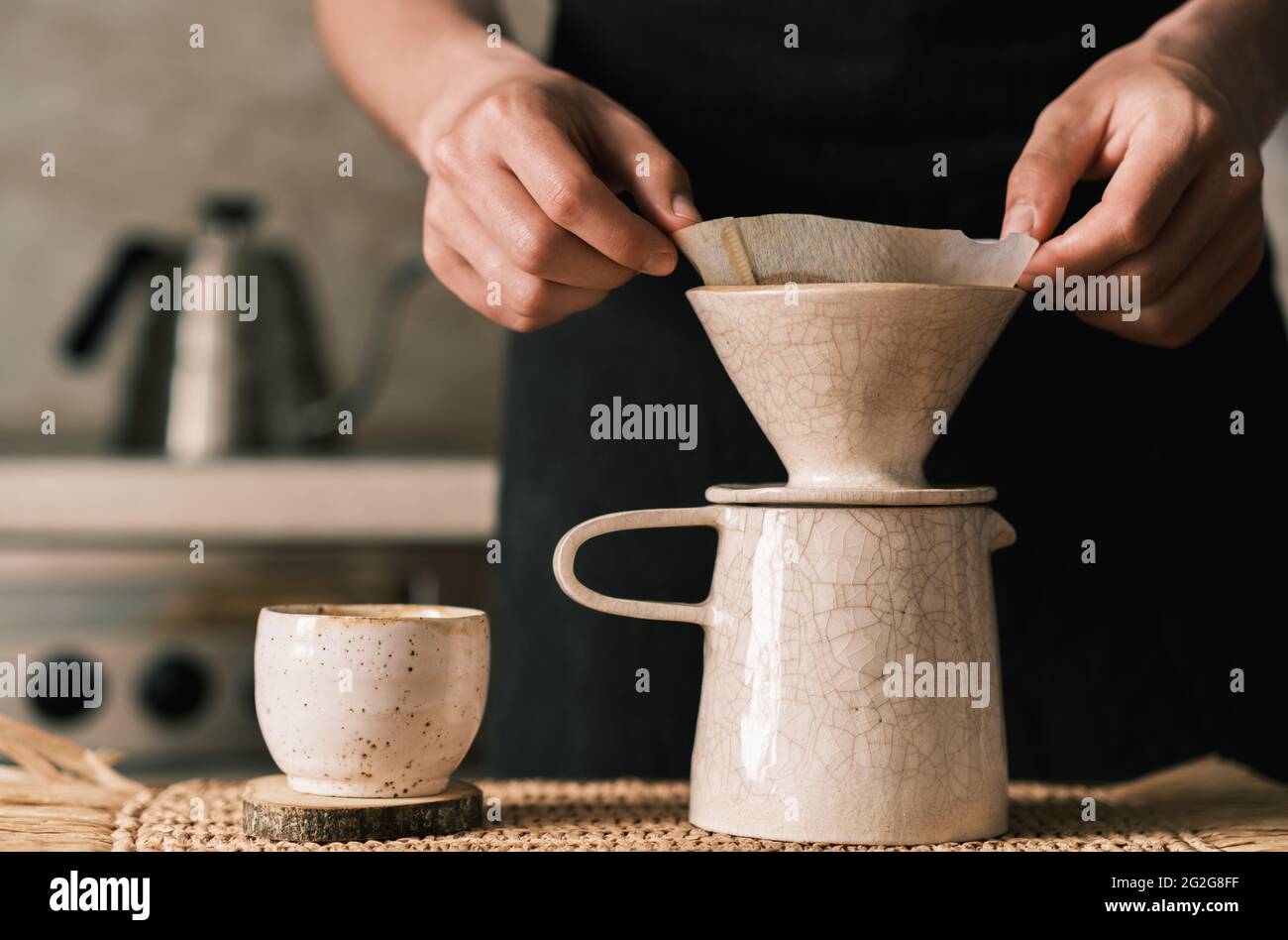 Brewing pourover coffee in the kitchen with a custom made filter Stock