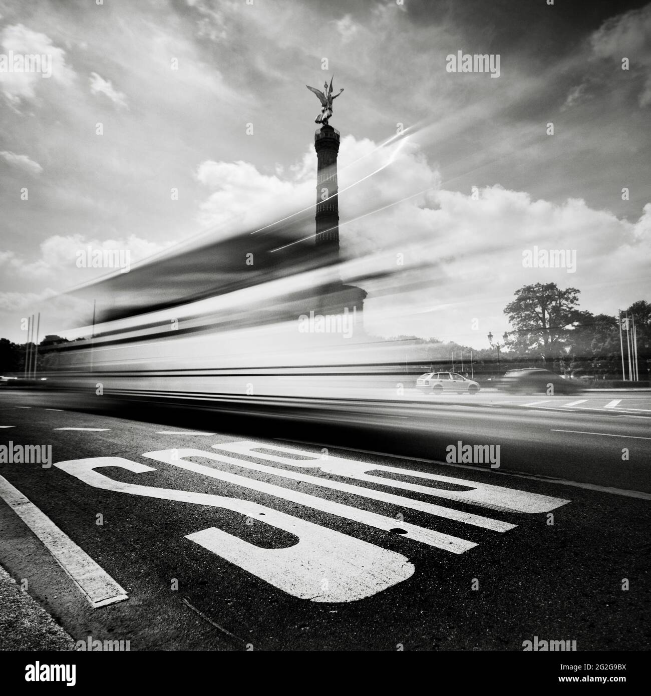 Long exposure of the Berlin traffic at the Großer Stern with the Berlin Victory Column. Stock Photo