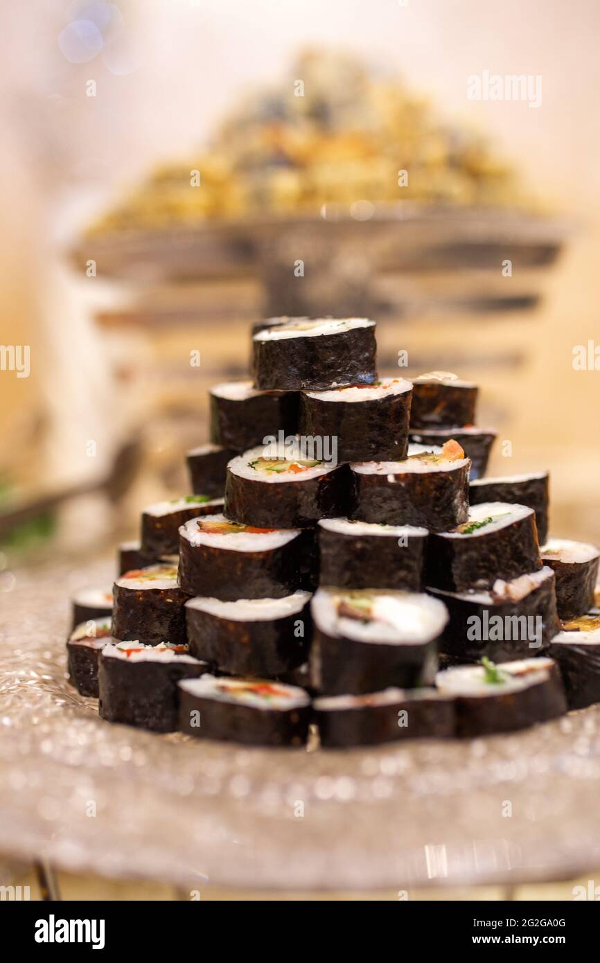 black roller rolls on a plate in a cafe Stock Photo