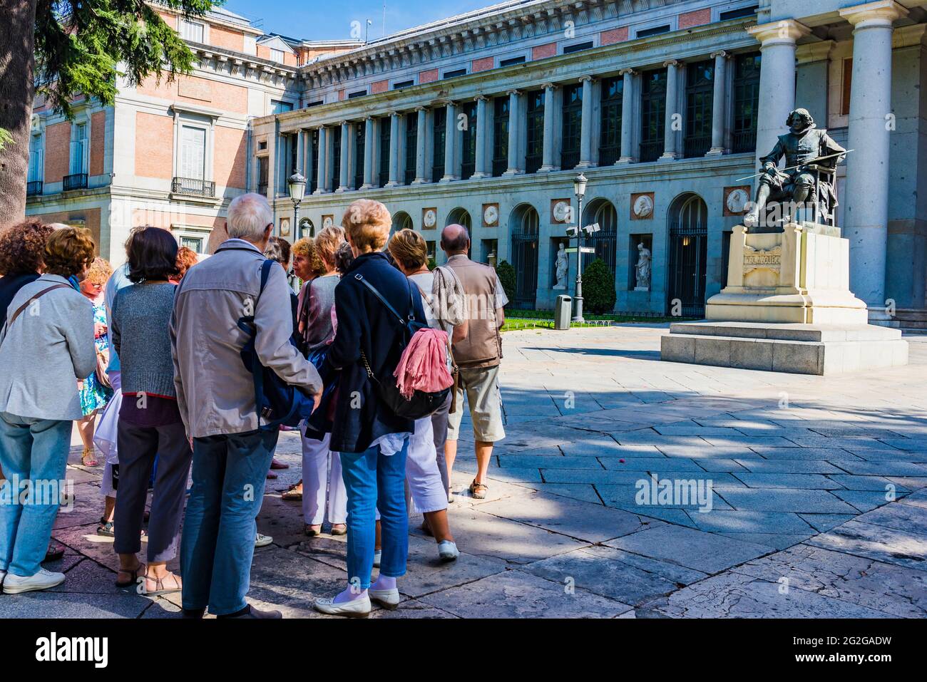 Group of tourists. The Prado Museum - Museo del Prado, officially known as Museo Nacional del Prado, is the main Spanish national art museum, located Stock Photo