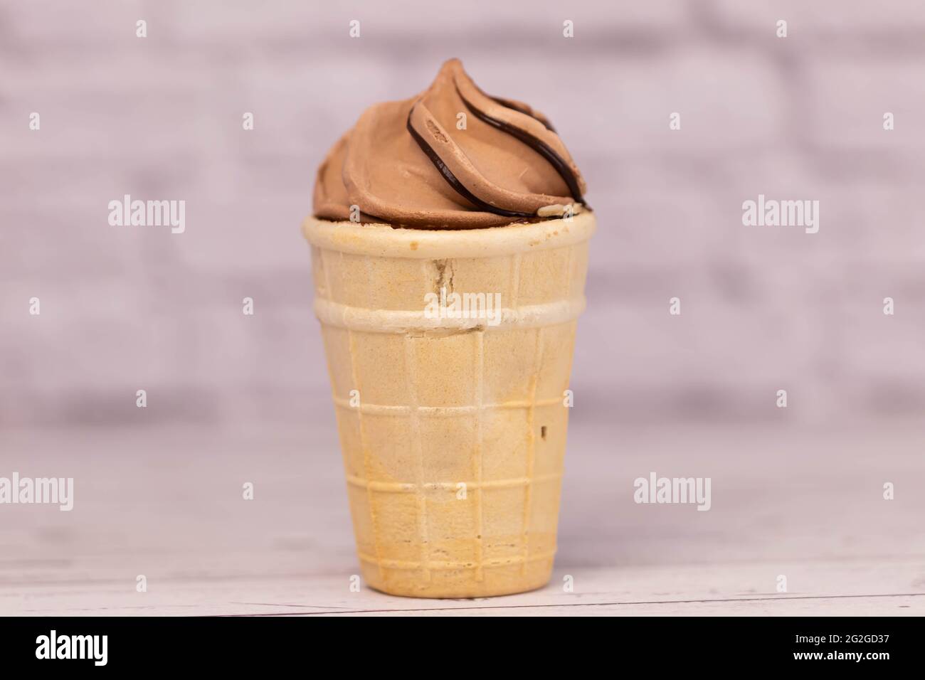 Delicious chocolate ice cream in a crispy waffle cup. Dessert Stock Photo