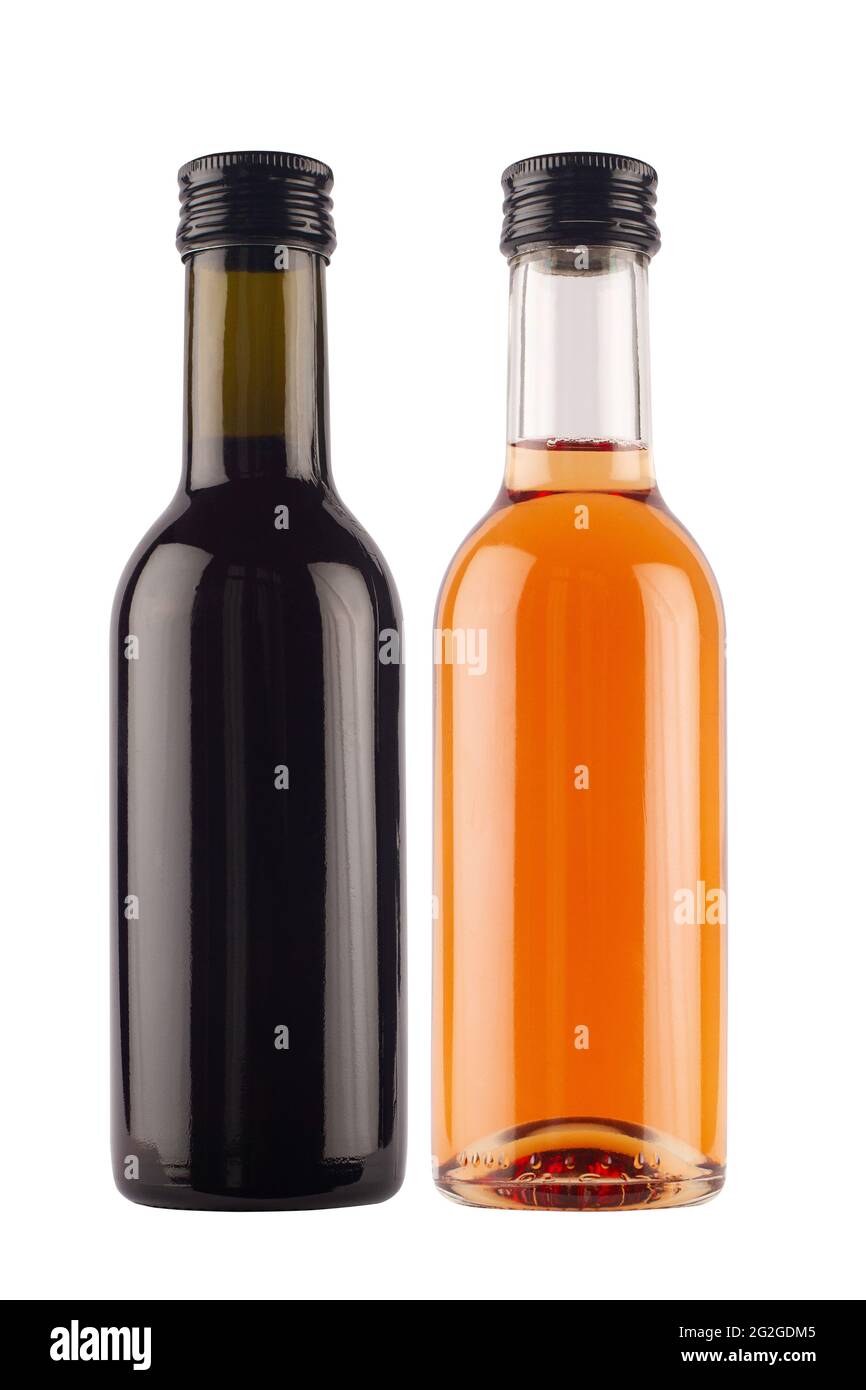 front view of small single serve miniature rose and red wine bottles with no label and black colored metallic screw cap isolated on white background Stock Photo