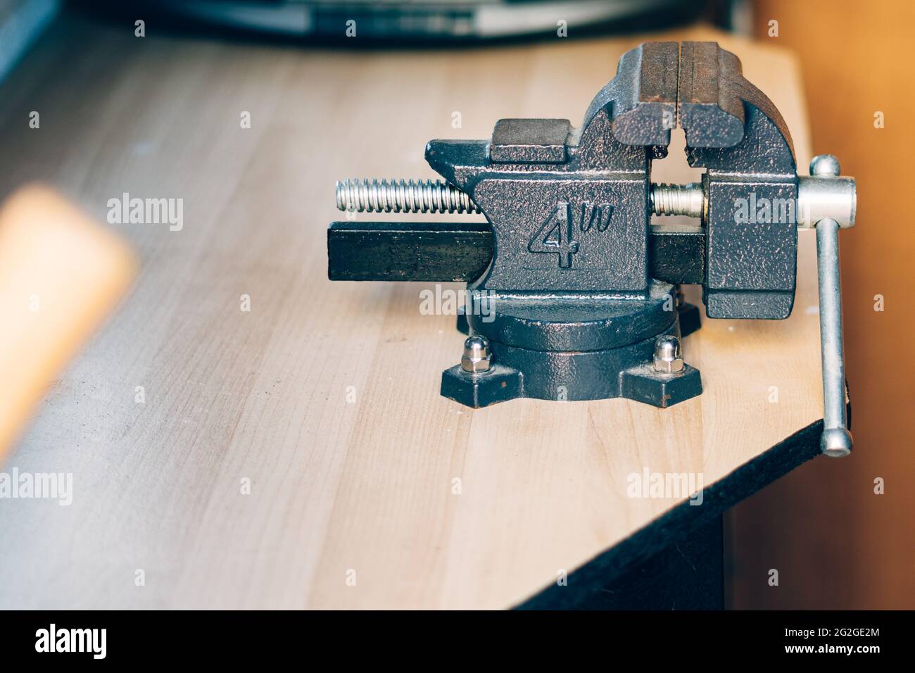 Bench vise. Metal clamps. Carpentry tools for fixing parts in various