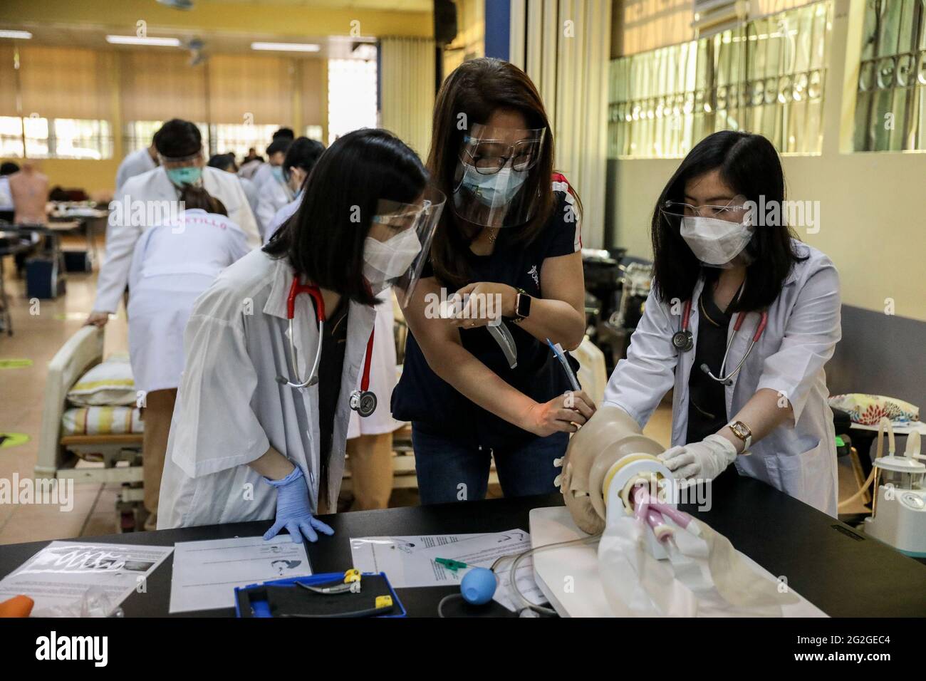 Manila, Philippines. June 10th 2021. Medical students perform an endotracheal intubation on a dummy during a face-to-face class at the University of Santo Tomas. The university started its limited face-to-face classes after the government allowed the resumption hands-on training and laboratory classes in campuses while observing health protocols to prevent the spread of the coronavirus disease. Stock Photo