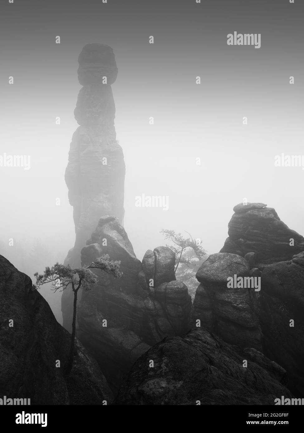 Fog on the Pfaffenstein in the Elbe Sandstone Mountains on the Barbarine. Stock Photo