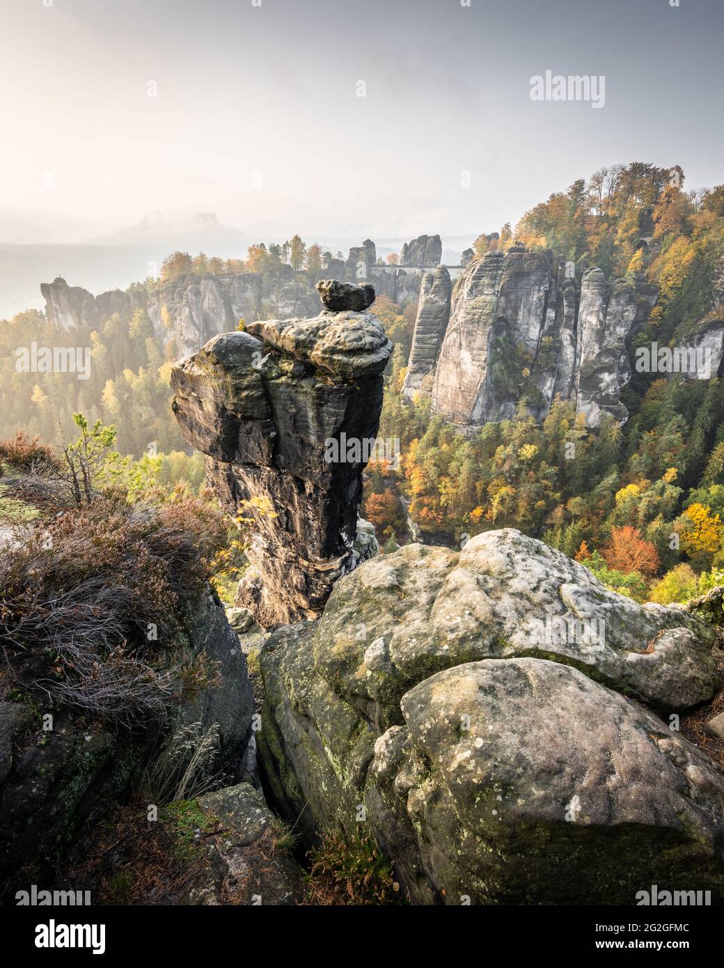 Elbe Sandstone Mountains with autumnal Wehlnadel in front of the bastion in the background. Stock Photo