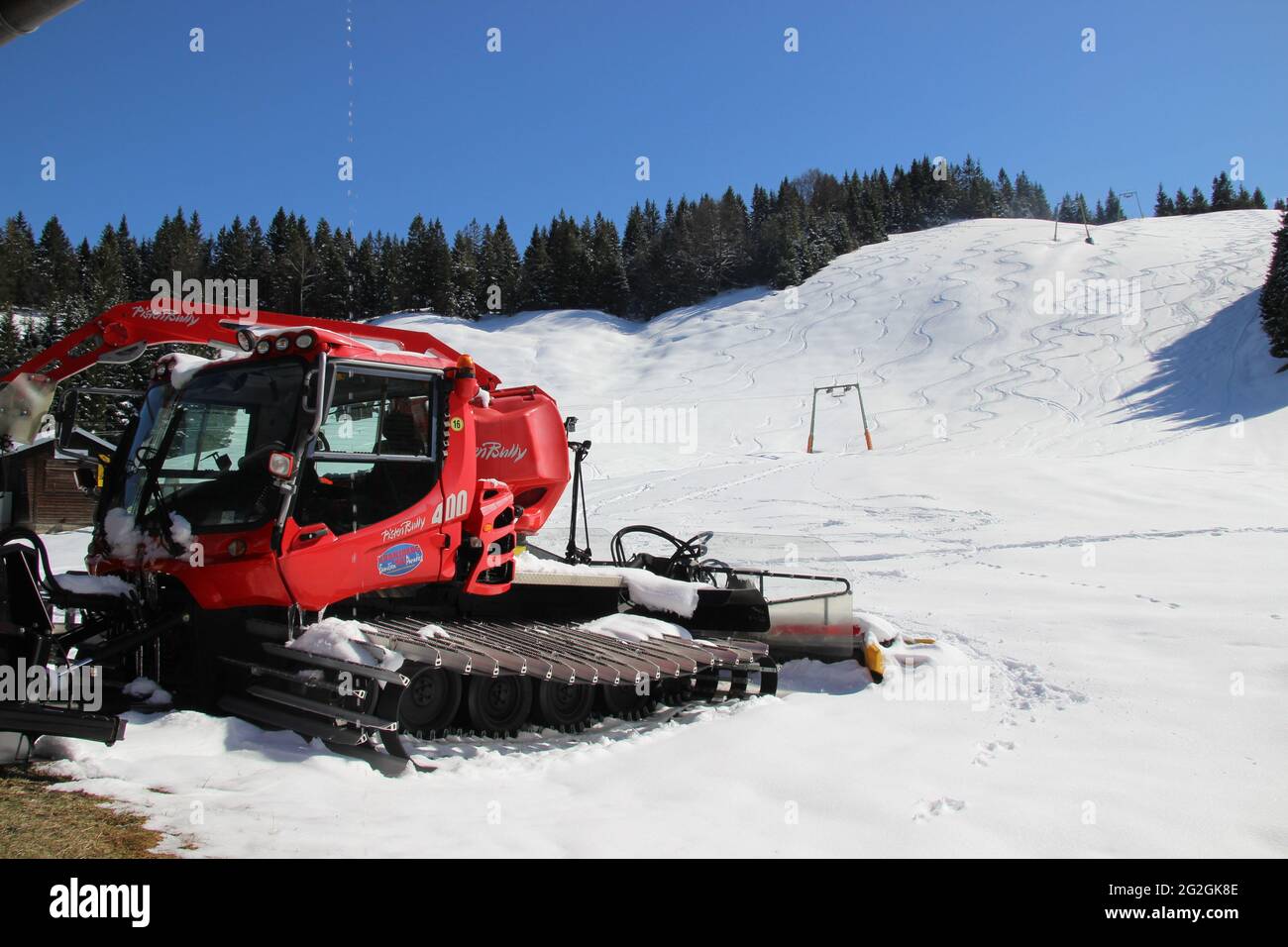 Pistenbully in the snow, hike in the skiing area of Mittenwald am Wildensee, Hoher Kranzberg, tracks in the snow, Europe, Germany, Bavaria, Upper Bavaria, Mittenwald, Werdenfelser Land, Isar Valley Stock Photo