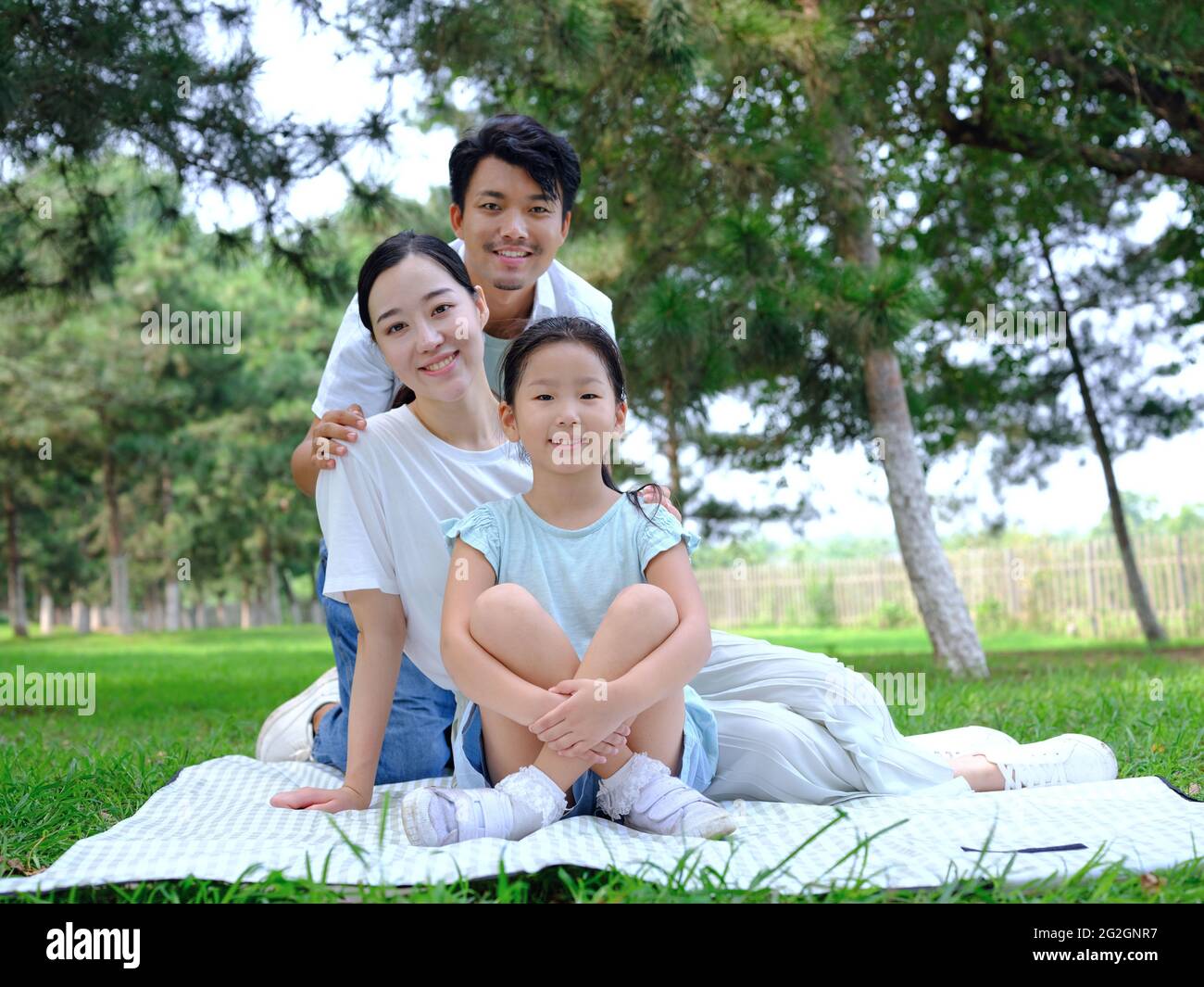 Happy family of three playing in the park high quality photo Stock ...