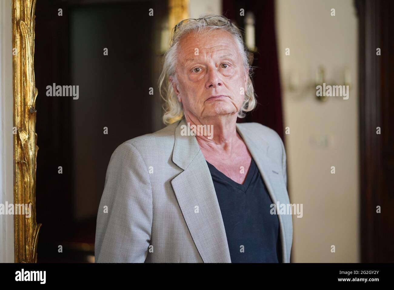 Berlin, Germany. 11th June, 2021. The director Frank Castorf in front of a photo rehearsal of his new production 'Fabian oder Der Gang vor die Hunde' at the Berliner Ensemble. Credit: Jšrg Carstensen/dpa/Alamy Live News Stock Photo