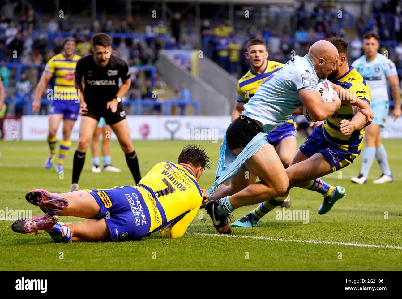 Wakefield Trinity's Lee Kershaw (right) has his shorts pulled down as