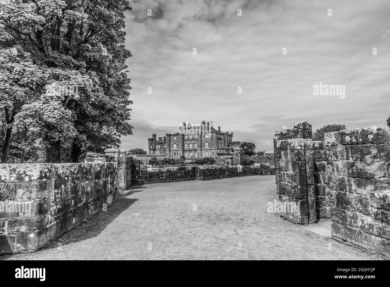 Scotland.The image in monochrome is of the main driveway leading to Culzean Castle as seen from the Ruined Archway that was a fortified gateway Stock Photo