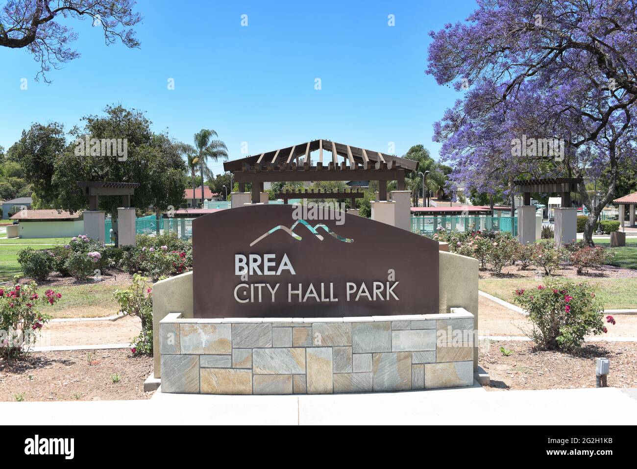 BREA, CALIFORNIA - 9 JUN 2021: Sign at City Hall Park with the Rose GArden and Plunge in the background. Stock Photo