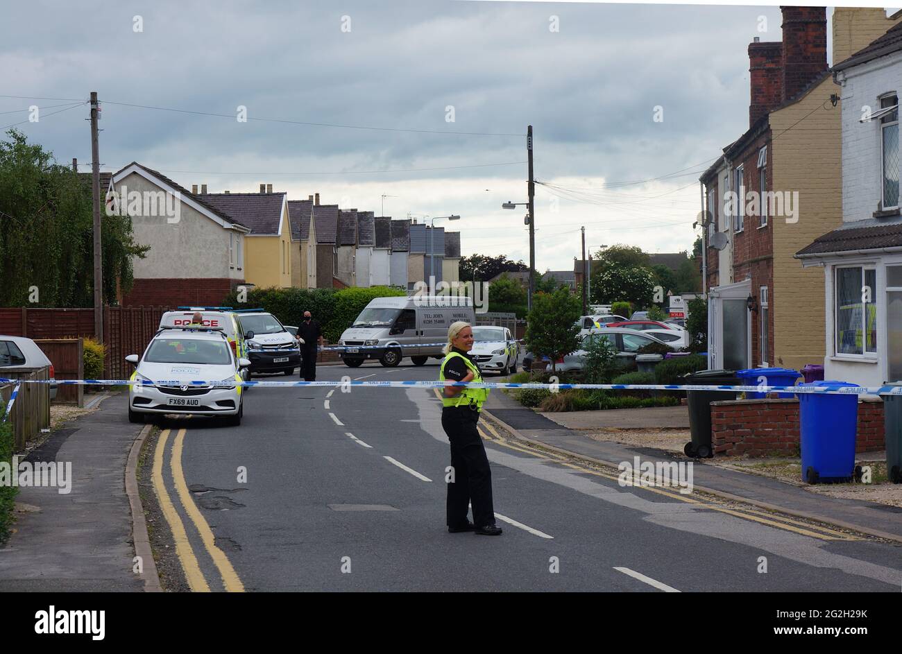 Police cordoned off Wyberton West Rd. after a bomb scare Police car at a house after a bomb scare which resulted in the nearby homes being evacuated Stock Photo