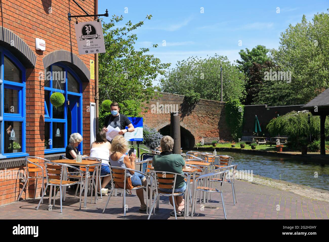 The Playwright's cafe, on the side of the Coventry Canal, at the restored Bishop Street Basin, in Warwickshire, UK Stock Photo