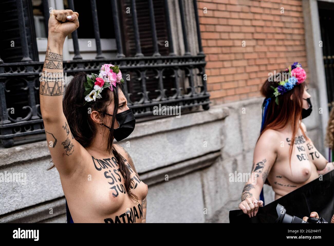 EDITORS NOTE Image contains nudity.) A protester seen making gestures in front of the Justice Ministry during the demonstration