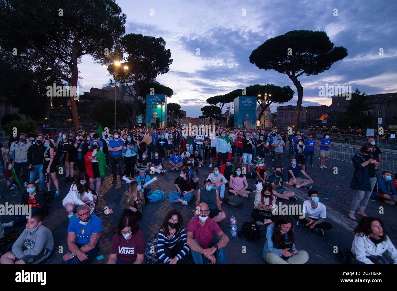 Rome, Italy. 11th June, 2021. Italy supporters on Via dei Fori Imperiali in RomeOn the occasion of European Football Championships, a maxi-screen was installed along via dei Fori Imperiali in Rome, with a limited number of people due to Covid-19 pandemic. Opening match between Italy and Turkey with Italian supporters seen on Via dei Fori Imperiali. (Photo by Matteo Nardone/Pacific Press) Credit: Pacific Press Media Production Corp./Alamy Live News Stock Photo