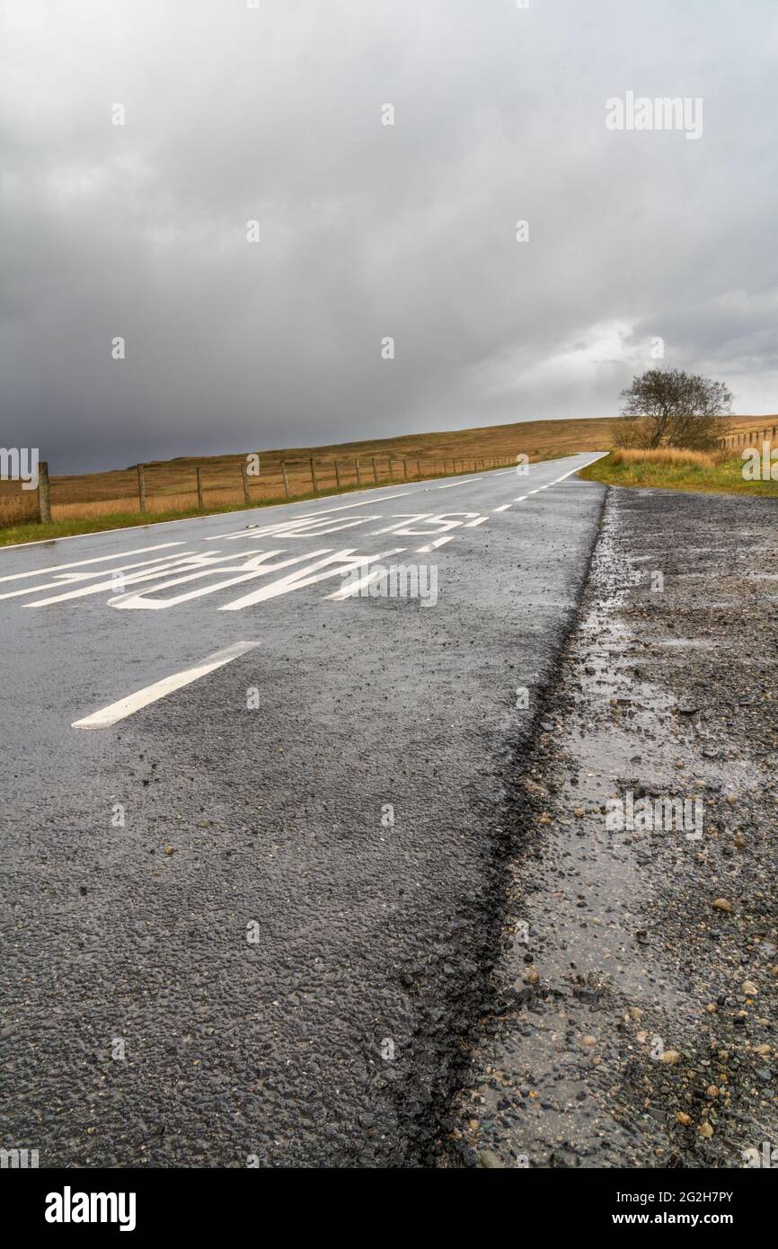 North of Pentrefoelas, North Wales, The A543 Road across grassy moor, part of the infamous EVO Triangle for racing vehicles, portrait. Stock Photo