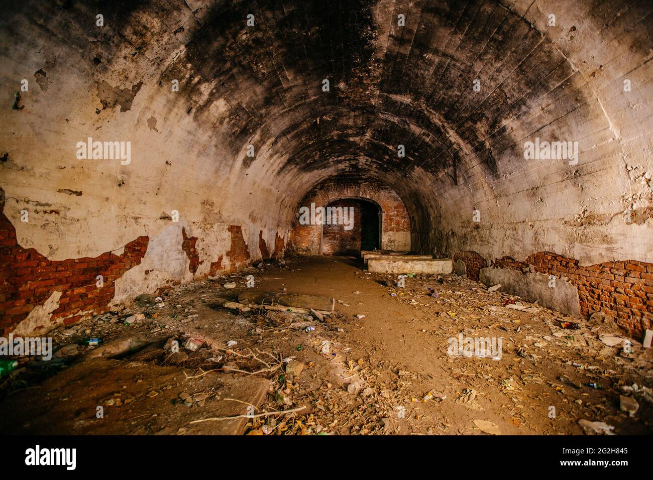Large old historical underground red brick tunnel. Stock Photo