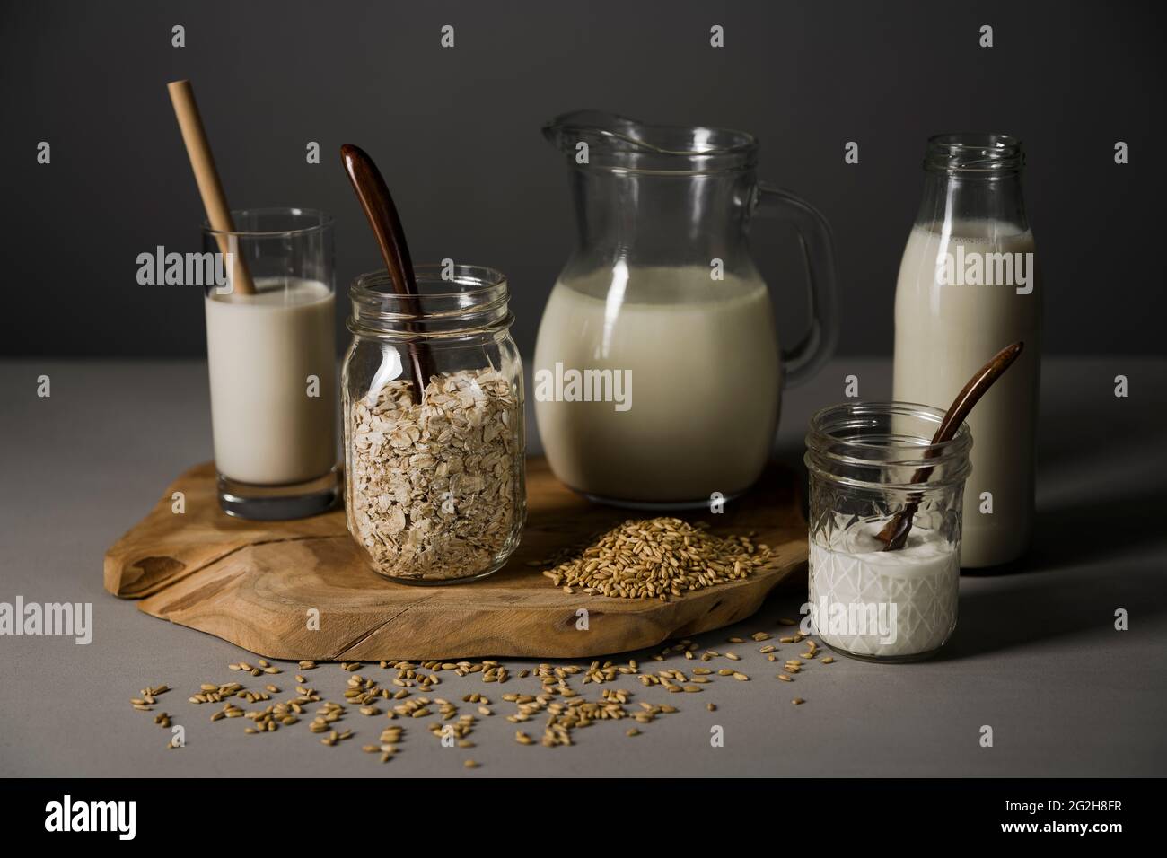 Oat milk, board, glasses, oats Stock Photo