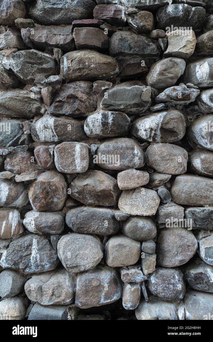Texture of a stone wall. Old castle stone wall texture background. Stone wall as a background or texture. Part of a stone wall, for background or texture. High quality photo Stock Photo