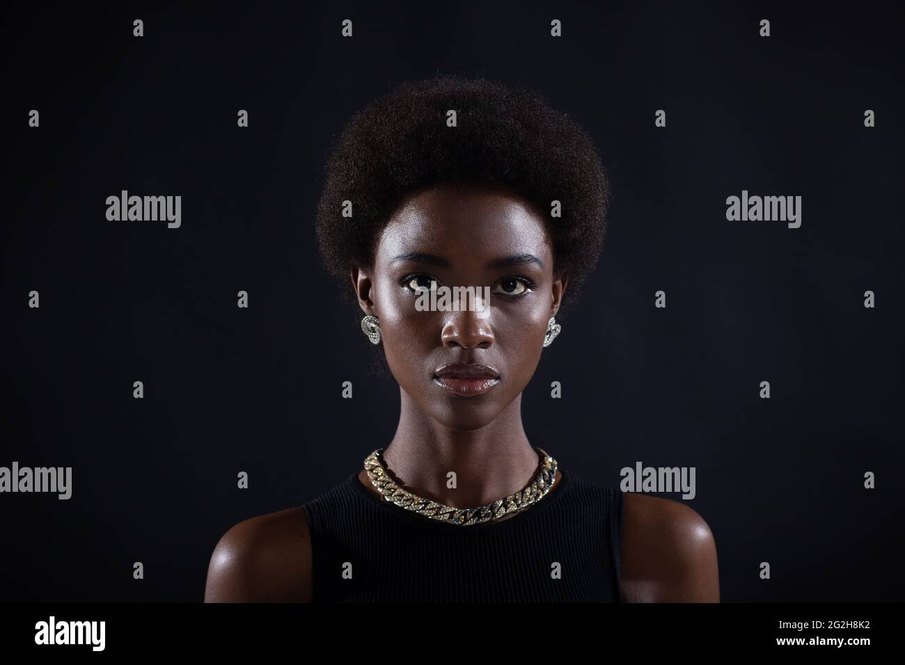Close up full face portrait of serious african american woman with afro ...