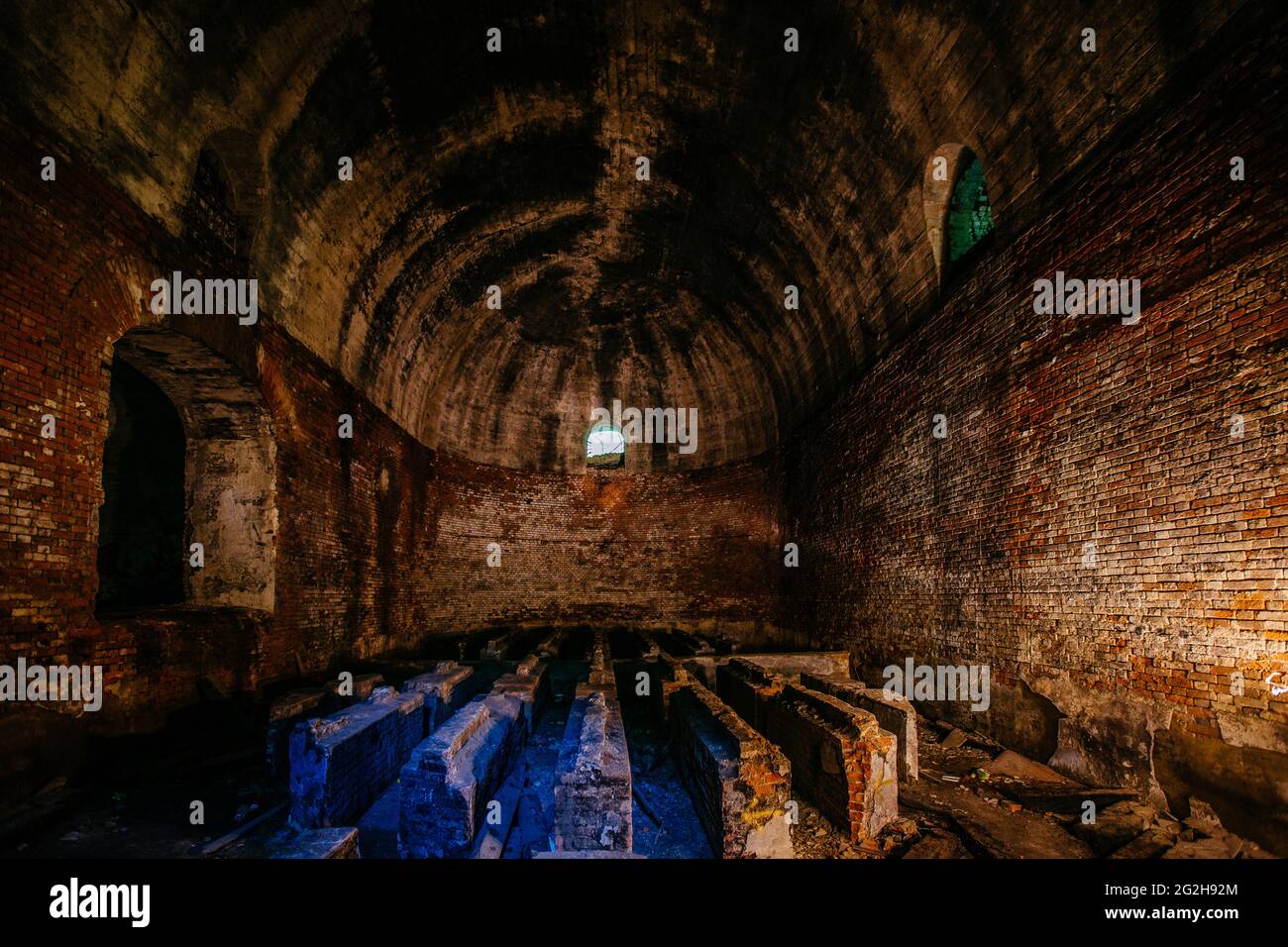 Large abandoned old underground red brick construction. Stock Photo