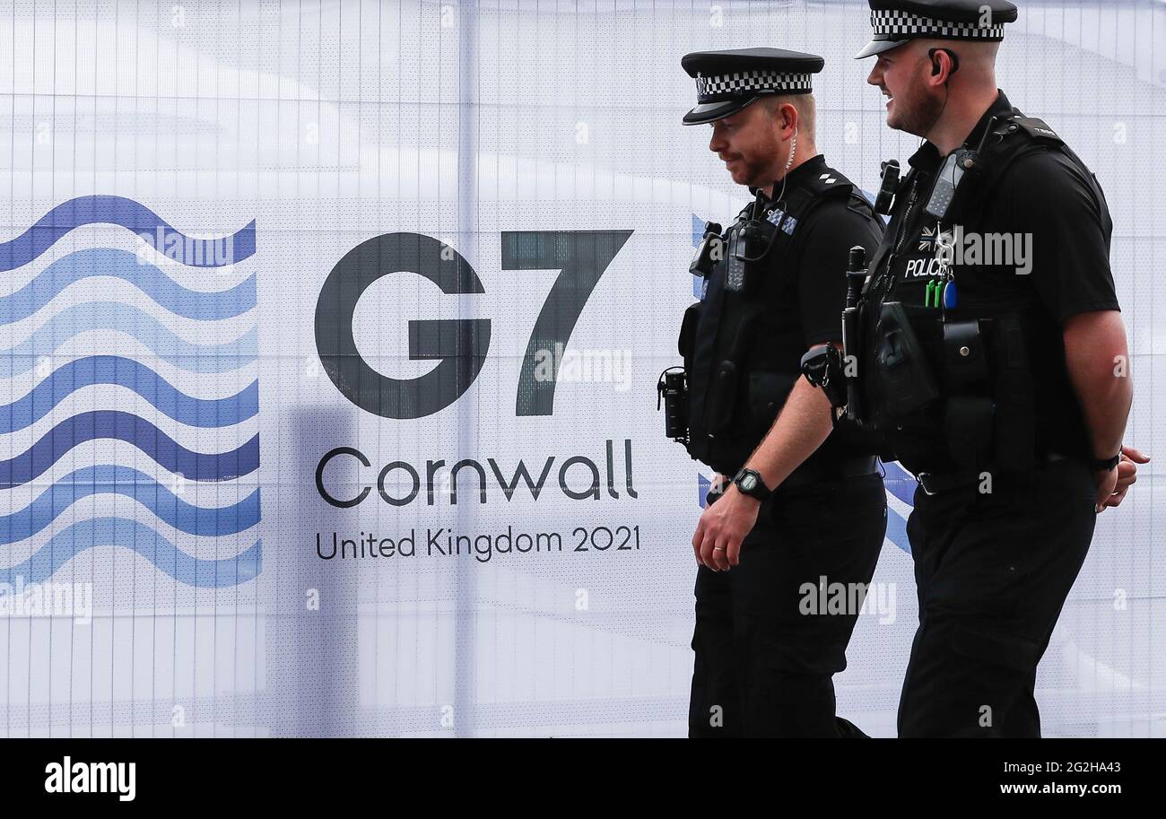 Cornwall, Britain. 11th June, 2021. Police officers patrol outside the G7 media center in Falmouth, Cornwall, Britain, on June 11, 2021. The first in-person G7 summit kicked off on Friday in Britain's southwestern resort of Carbis Bay, Cornwall, in almost two years. Credit: Han Yan/Xinhua/Alamy Live News Stock Photo