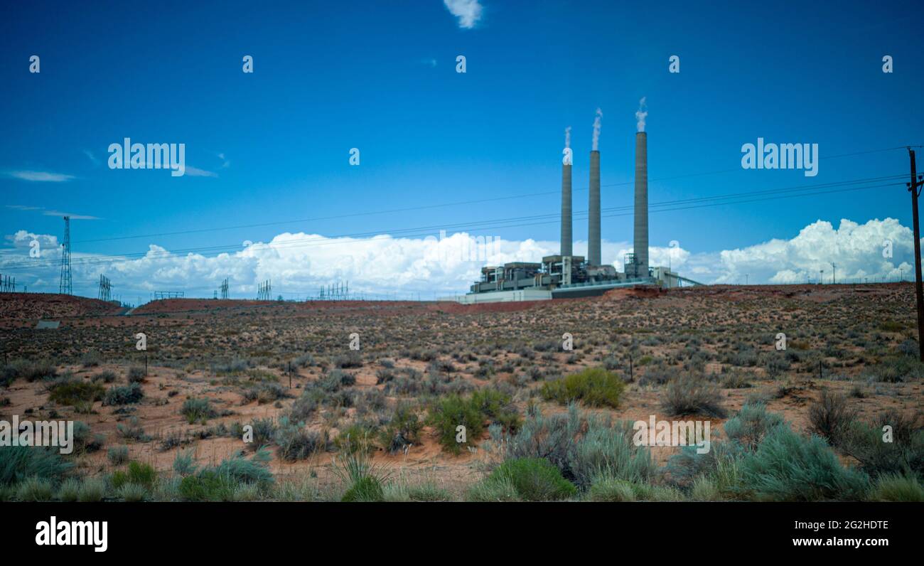 Chimneys of the soon to be decommissioned Salt River Project - Navajo Power Station in the desert landscape near Page, Arizona. One of the three units was already decommissioned in the fall of 2019 Stock Photo