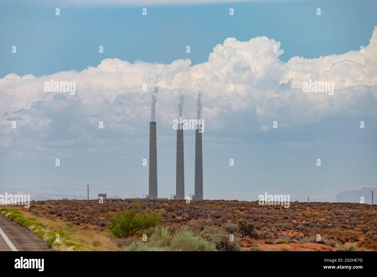Chimneys of the soon to be decommissioned Salt River Project - Navajo Power Station in the desert landscape near Page, Arizona. One of the three units was already decommissioned in the fall of 2019 Stock Photo