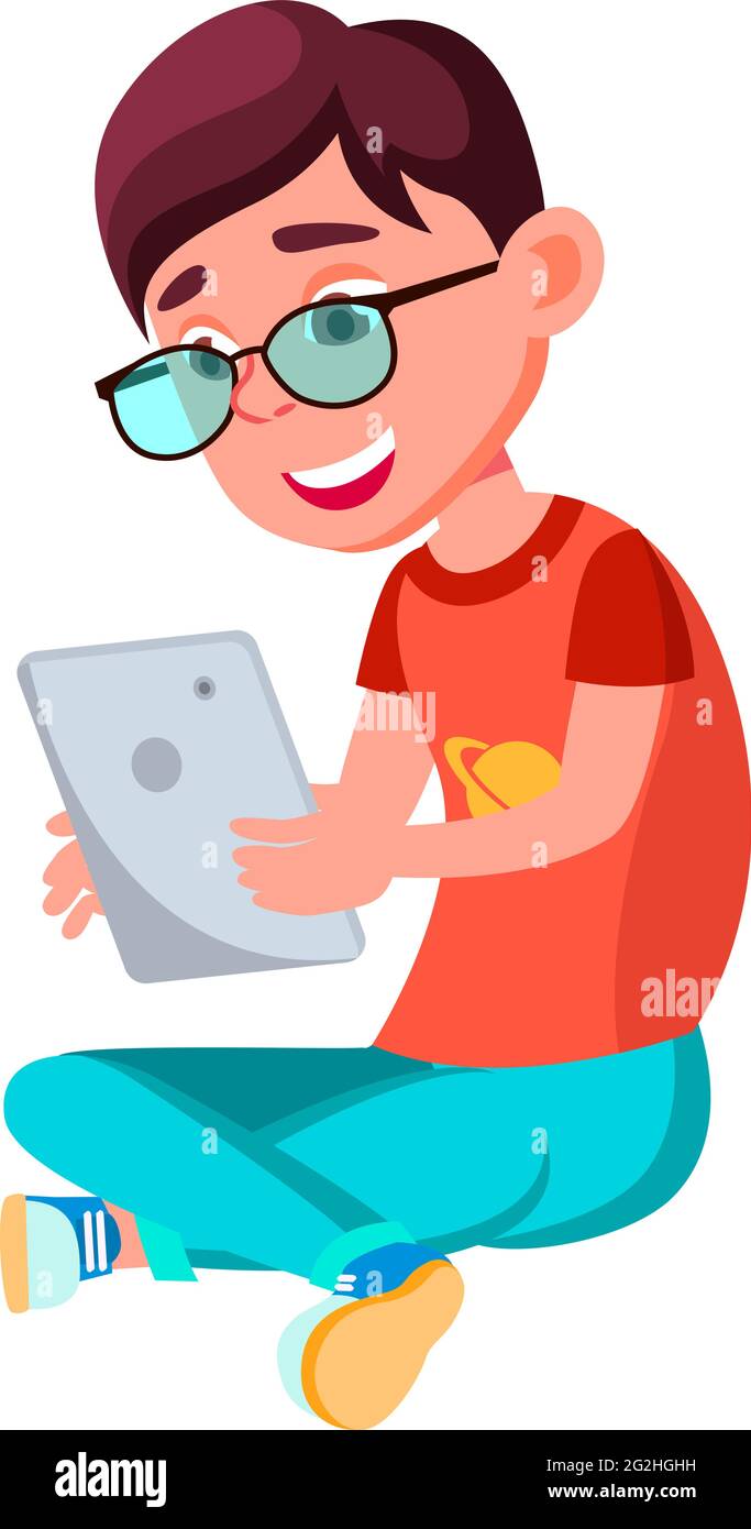 playful boy sitting on floor and playing game app on tablet cartoon