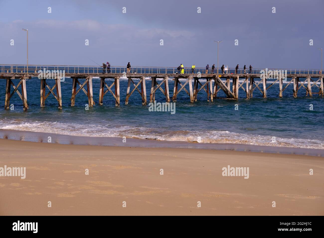 People fishing from the jetty at Port Noarlunga in South Australia Stock Photo